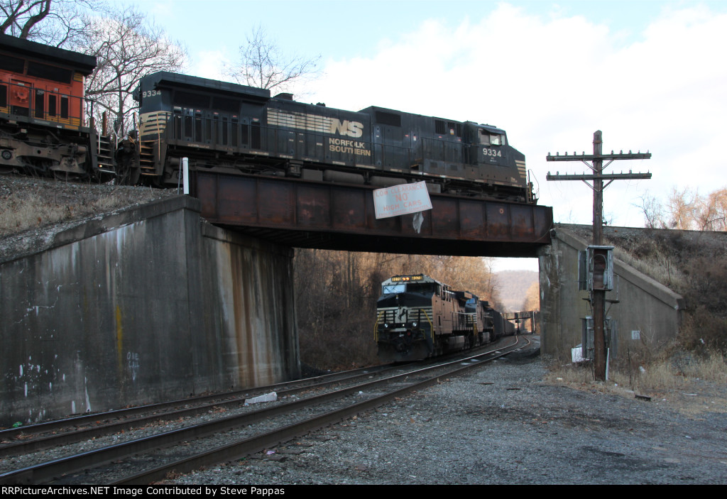 NS 9334 passes over a coal train led by NS 4079
